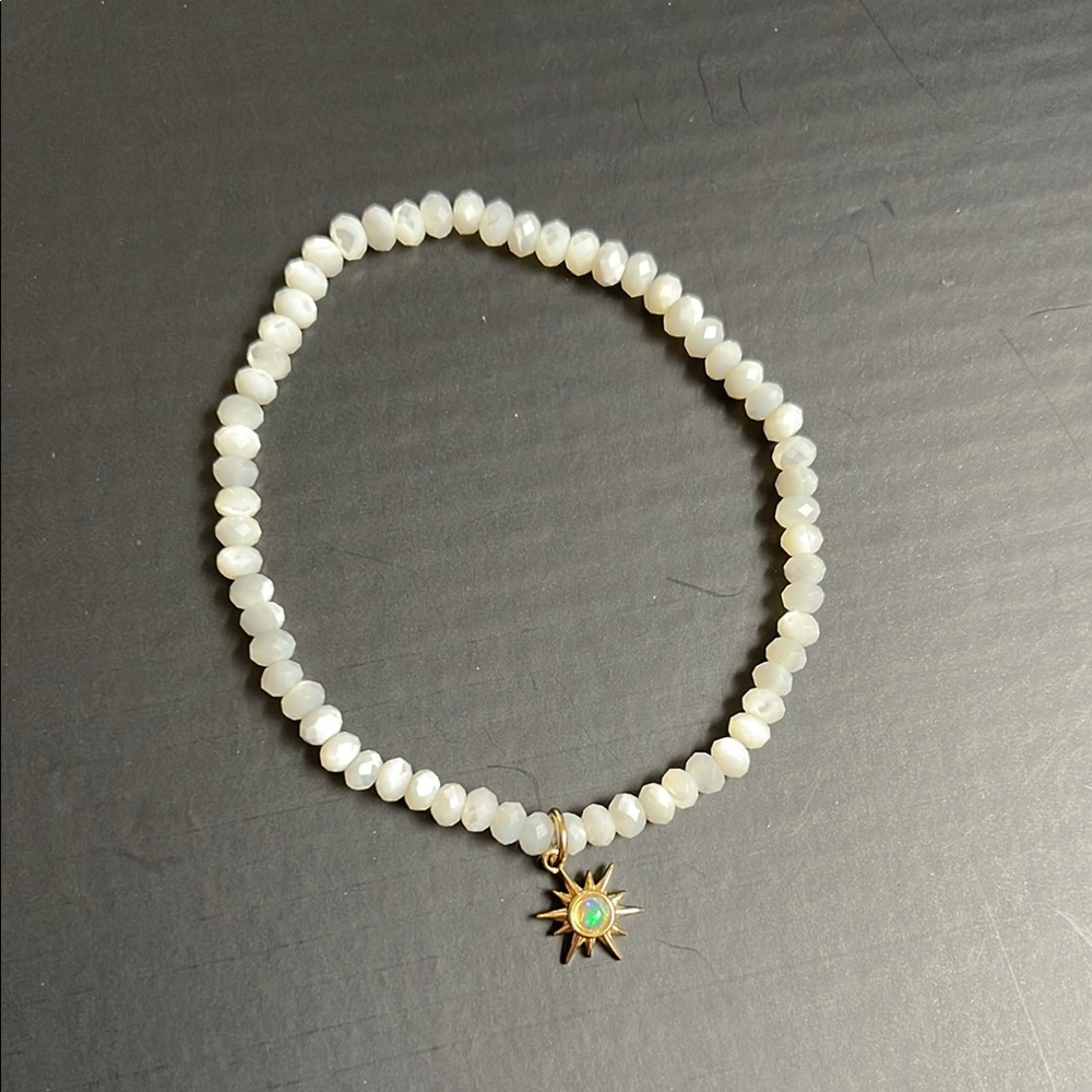 Awe Inspired White  mother of pearl Beaded Bracelet with Gold Sun Charm opal